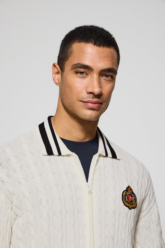 Beige cable-knit cardigan with zip and nautical logo